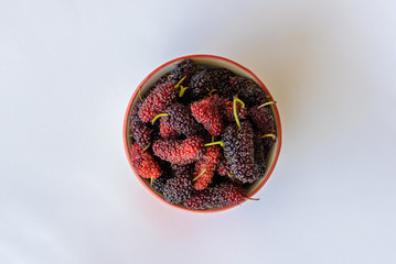 Organic Mulberry fruits In ceramic cup