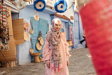Tourist on a street with souvenirs - Chefchaouen, Morocco