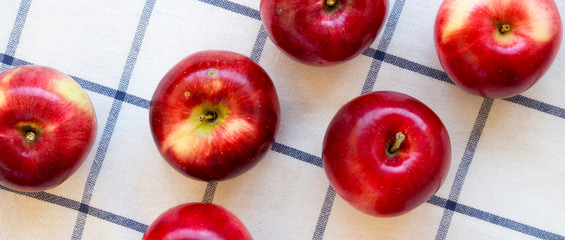 Fresh raw red apples on cloth, view from above. Flat lay, overhead, top view.