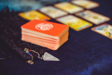 Mystical atmosphere of tarot card on the table, esoteric concept, fortune telling and predictions 