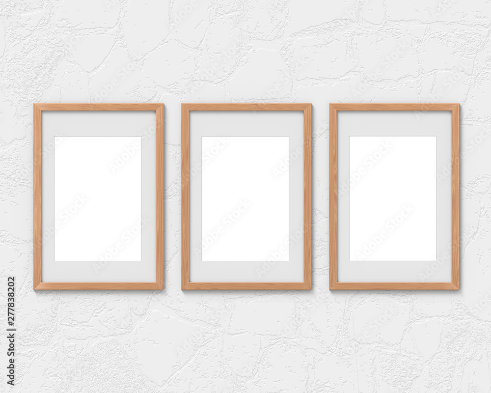Fototapete set of 3 vertical wooden frames mockup with a border hanging on the wall. empty base for picture or 