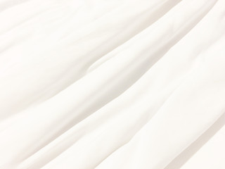 Fototapeta na wymiar messy white bed sheets background
