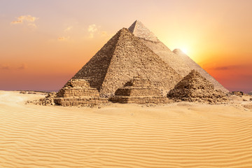 Fototapeta na wymiar The famous Giza Pyramids in the desert at sunset, Egypt