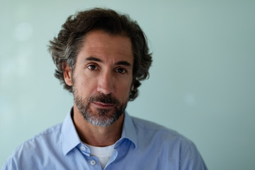 Businessman looking at camera in office