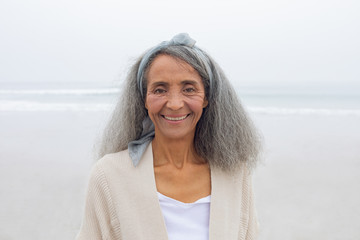 Woman smiling at the beach © wavebreak3