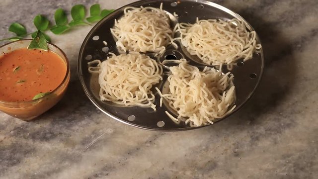 Idiyappam/ String Hoppers -Traditional Kerala Steamed Breakfast served with Chickpea (Kadala) curry top vew