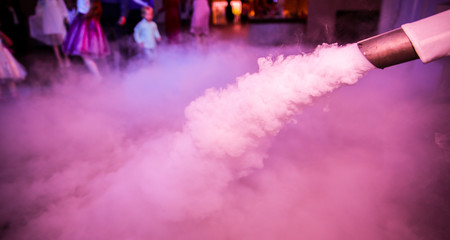 Low smoke effect at the wedding reception. Party entertainment.