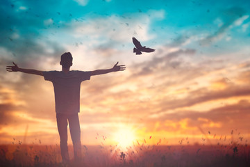 Happy man rise hand on morning view. Christian inspire praise God on good friday background. Male self confidence empowerment on mission arm courage nature the sun concept strength wisdom - obrazy, fototapety, plakaty