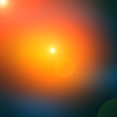 Abstract dark blue blurred background with orange spot light.