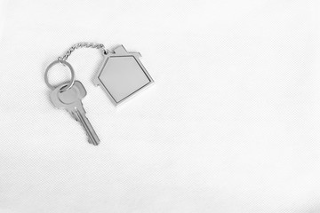 House key with home keyring in on white background