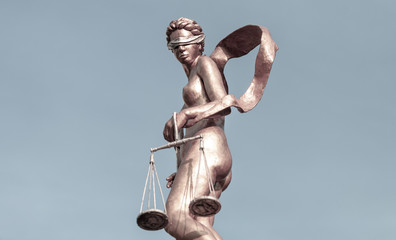 Lady justice blindfolded holding scales, Law and justice concept