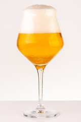 Glass of beer on white background