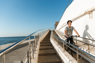 Young asian man riding a bicycle