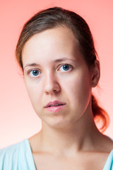 Portrait of a beautiful woman isolated pink background
