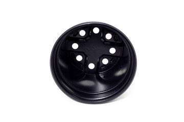 plastic black flowerpots on white background Growing plant in black plastic flowerpot