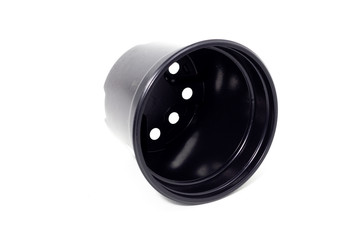 plastic black flowerpots on white background Growing plant in black plastic flowerpot