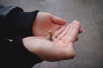 Little bronze statuette in the hands