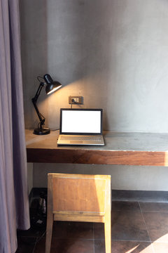 laptop with blank white screen for mock up template background on Table
