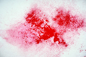 Red powder explosion on white background. Colored cloud. Colorful dust explode. Paint Holi.