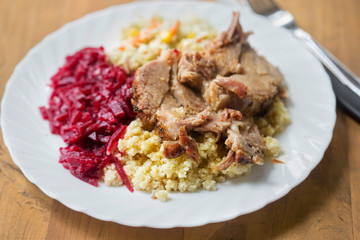 Pork shoulder with mashed potatoes and beetroots