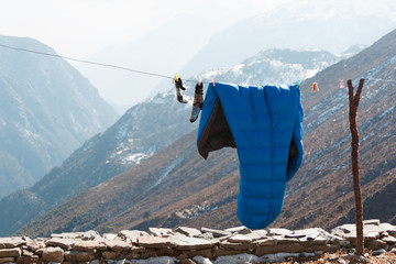 Sleeping bag and socks on a rope for drying and airing. Nepal. Everest trekking.