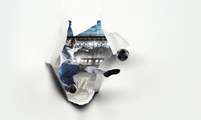 Paper breakthrough hole effect and soccer player. Mixed media