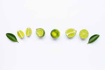 Fresh limes with leaves isolated on white