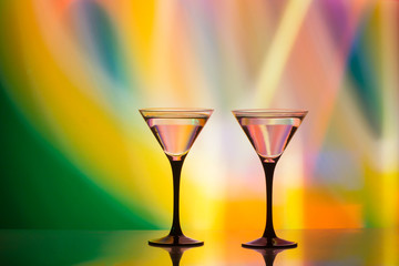 colourful cocktail on the club light background.