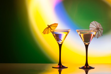 colourful cocktail on the club light background.