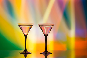 colourful cocktail on the club light background.