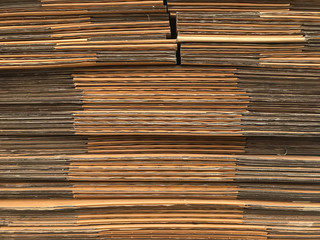 side view of folded brown paper box stack prepare for using.