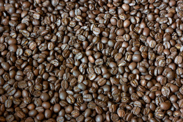 Selective focus roasted coffee beans background