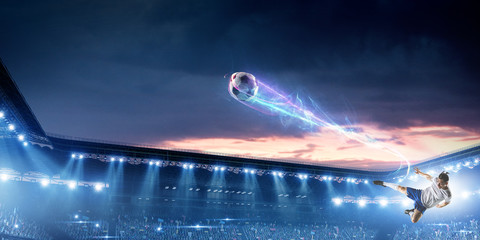 Soccer player on stadium in action. Mixed media