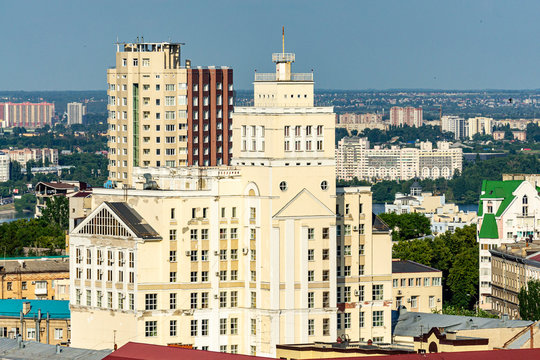 View from window of skyscraper on modern high-rise building against blue sky and high-rise buildings. Close-up of high-rise building located in foreground. Voronezh, Russia, June, 2019