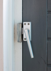 Close up view of aluminum door window handle