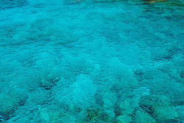 Natural background of emerald, turquoise sea water