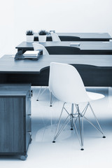 wooden desks and a chairs