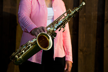 woman playing the saxophone