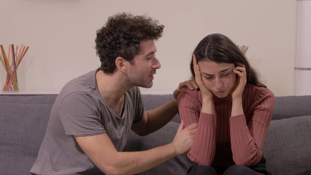 husband asking forgiveness for the betrayal of his sad and crying wife