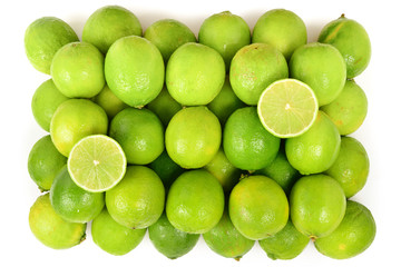 Many fresh limes on white background.
