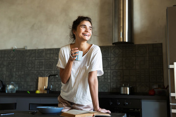Attractive young woman having healthy breakfast
