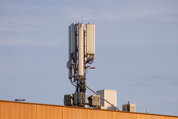 Telecommunication antenna for mobile communication. On a building in a city.