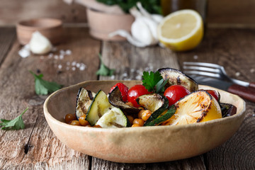 Healthy vegan bowl with grilled vegetables, and roasted chickpeas
