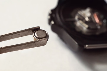 macro of replacing a watch battery