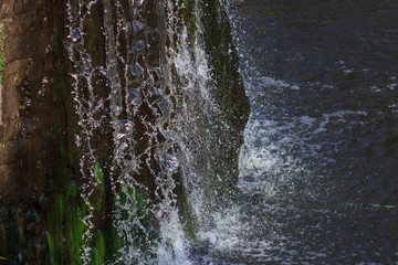 Water from the waterfall as a backdrop