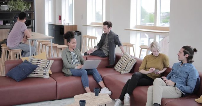 Meetings in a busy coworking office space