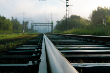 railway tracks going into the fog