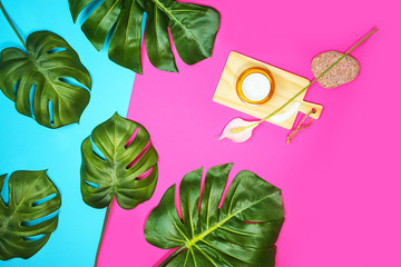 Tropical leaves Monstera isolated, Swiss Cheese Plant and jar of cream or mask for beautiful skin...