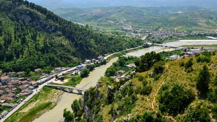 The albanian ancient city of Berat, designated a UNESCO World Heritage Site in 2008. Panoramic top view from the Berat Castle to Gorica quarter, Gorica bridge and Osum (Osumi) river