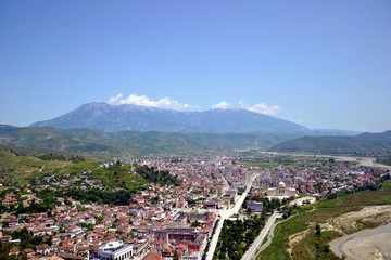 The albanian city of Berat, designated a UNESCO World Heritage Site in 2008. Top view from the Berat Castle to the city center and Tomorr Mountain  (Mount Tomorr) in the background. Albania